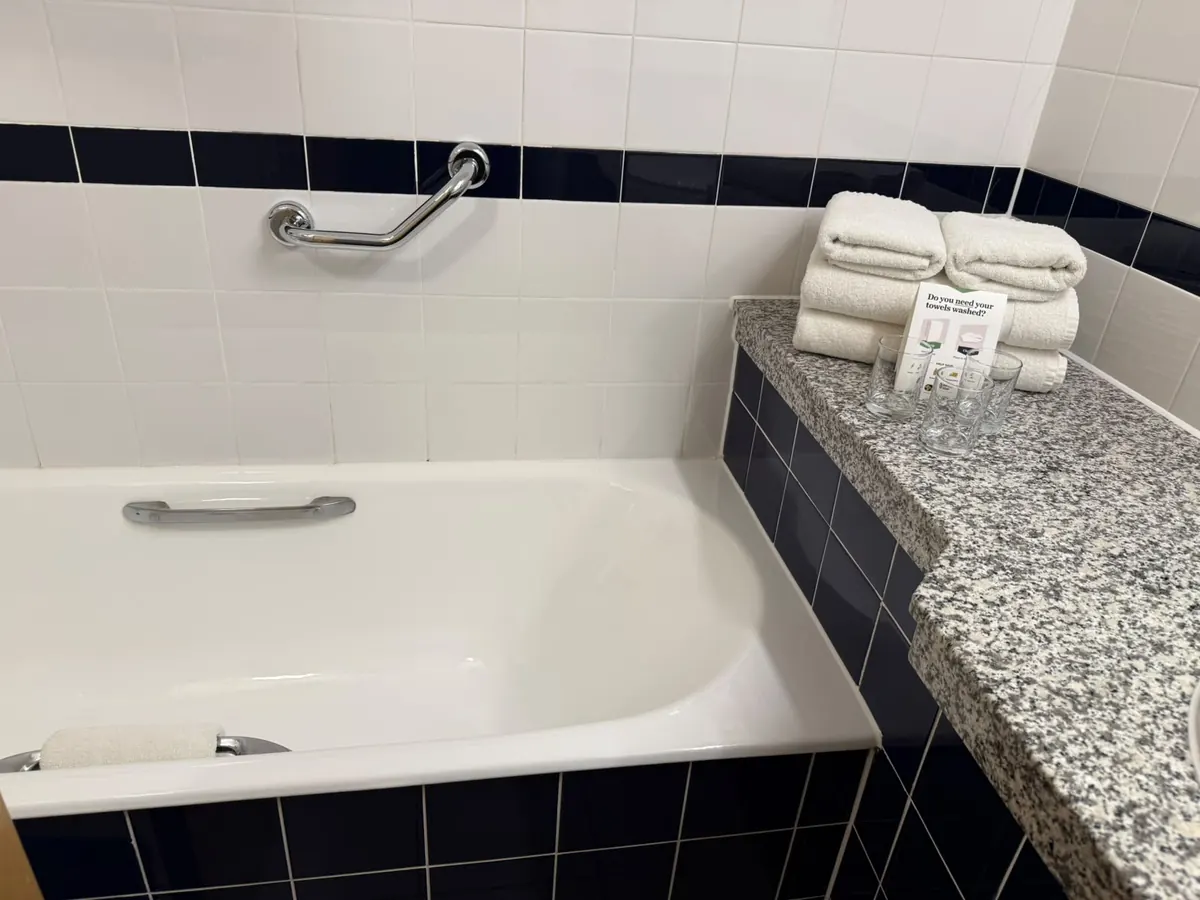 Bathroom reset with fresh towels after a Dr. Sparkle clean