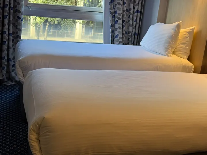 Twin bedroom turnover, after cleaning by Dr. Sparkle