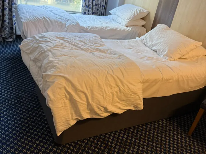 Twin bedroom turnover, before cleaning